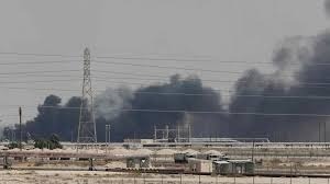 Black smoke rises over industrial facilities after a strike in the Gulf region.